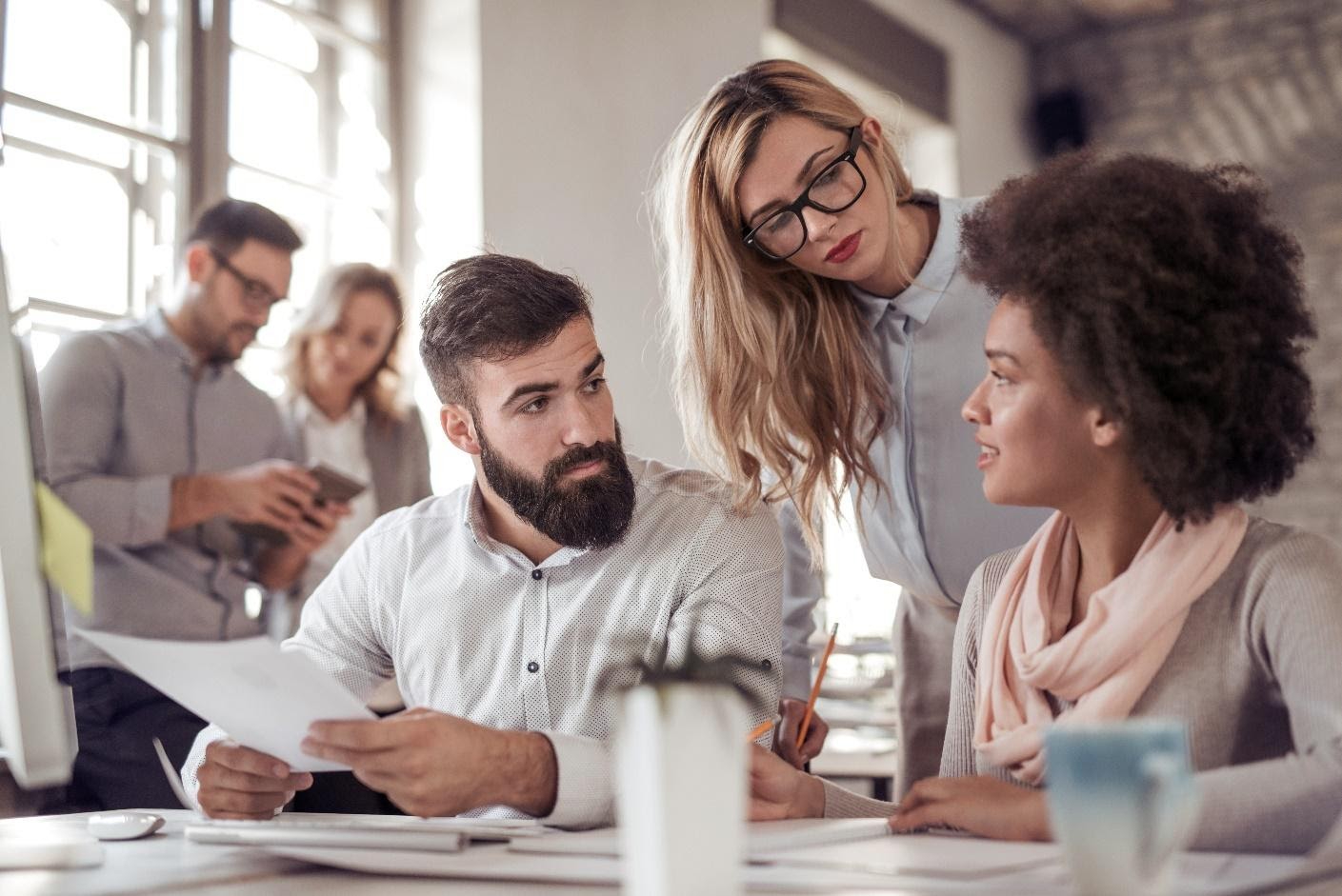 A group of people sitting around a table.